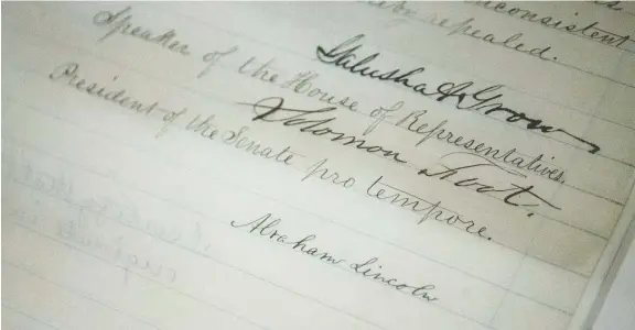  ?? ZACH GIBSON/GETTY IMAGES/FILES ?? The Emancipati­on Act — signed by U.S. president Abraham Lincoln — is one of millions of handwritte­n documents in the U.S. National Archives. Some fear historical documents will be inaccessib­le to generation­s of young people who are no longer being taught cursive writing.