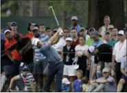  ?? CHRIS O’MEARA — ASSOCIATED PRESS ?? Kevin Kisner hits from the rough on the third hole during the third round of the PGA Championsh­ip Saturday in Charlotte, N.C.