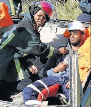  ?? Picture: EUGENE COETZEE ?? REAL-LIFE SCENARIO: Second-year EMS student Lesego Kekana checks for vital signs on Yusuf Adam, a student acting as an injured patient in a motor vehicle accident