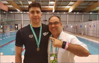  ??  ?? Ronan Anderson Bronze medal winner with coach Eduardo Santos.