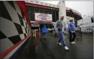  ?? WADE PAYNE — THE ASSOCIATED PRESS ?? Fans leave the track as rain falls before the Monster Energy NASCAR Cup Series race April 23 in Bristol, Tenn.