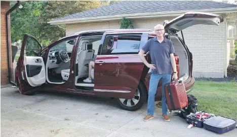  ?? KAREN MCCREDIE ?? Good Dad loads up the 2017 Chrysler Pacifica Hybrid, a suburban hauler with a cargo capacity surpassed only by its fuel economy.