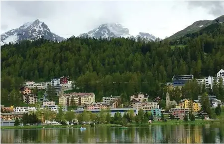  ??  ?? Once the snow melts, the beautiful resort town of St. Moritz, Switzerlan­d, becomes reasonably affordable.