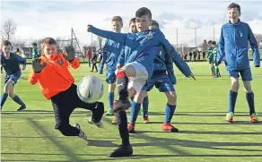  ??  ?? Pupils from Ancrum Road in action at the Dundee primary schools Soccer Sevens at Dawson Park.