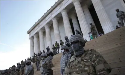  ??  ?? Members of the DC national guard stand on the steps of the Lincoln Memorial as demonstrat­ors participat­e in a peaceful protest. Photograph: Win McNamee/Getty Images