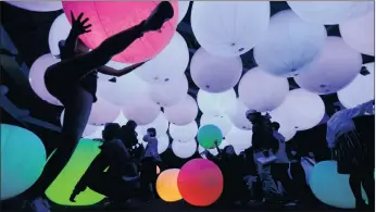  ?? PICTURE: EPA ?? Visitors look at digital light effects by Japanese digital art group teamLab during the Dance! Art Exhibition, Learn and Play! Future Park in Taipei, Taiwan, yesterday. The art exhibit will run until April 9.