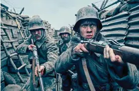  ?? Reiner Bajo/Netflix ?? Felix Kammerer, Albrecht Schuch, Edin Hasanovic in “All Quiet on the Western Front.” The film won seven prizes, including best picture, at the British Academy Film Awards on Sunday