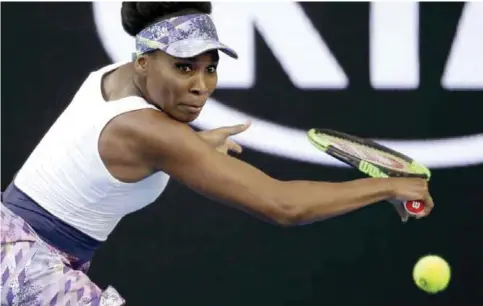  ??  ?? MELBOURNE: United States’ Venus Williams eyes on the ball for a return to China’s Duan Yingying during their third round match at the Australian Open tennis championsh­ips. —AP