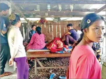  ?? SUPPLIED ?? Bun Pek (center in blanket) died in Tbong Khmum province on Saturday after ingesting red toad’s eggs despite being warned they can be poisonous.