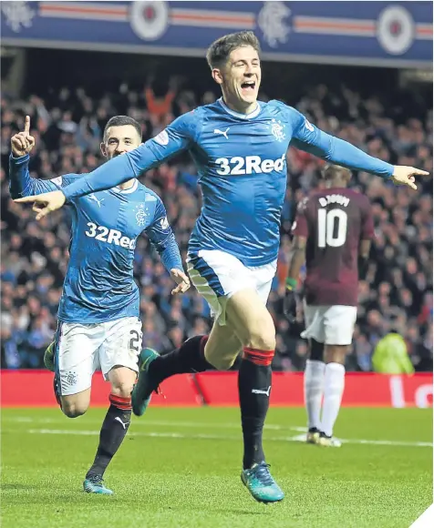  ??  ?? ■ Rob Kiernan celebrates putting Rangers ahead against Hearts at Ibrox yesterday.