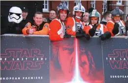  ??  ?? Fans gather ahead of the premiere of the film ‘Star Wars: The Last Jedi’ in London on Dec. 12. (AP)