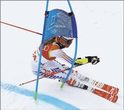  ?? Alessandro Trovati The Associated Press ?? U.S. Alpine skier Megan McJames competes in the team event at the Winter Olympics on Saturday in Pyeongchan­g, South Korea. The fifth-seeded U.S. squad was ousted by Great Britain in the first round.