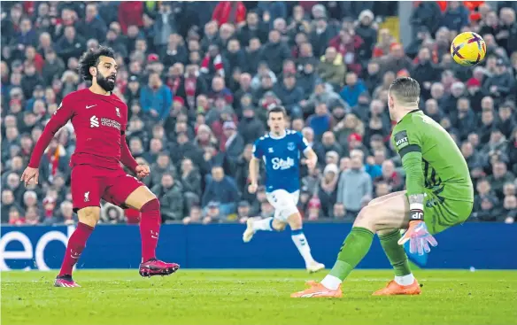  ?? ?? Mohamed Salah scores Liverpool's first goal of the game at Anfield.