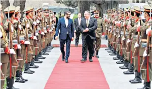  ??  ?? Mike Pompeo, right, is welcomed at the presidenti­al palace in Kabul