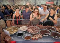  ?? AFP ?? Customers looking at different kinds of insects at a stall in Sydney. —