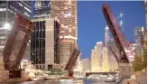  ??  ?? Bridges across the Chicago River were raised to control access into downtown after widespread looting.