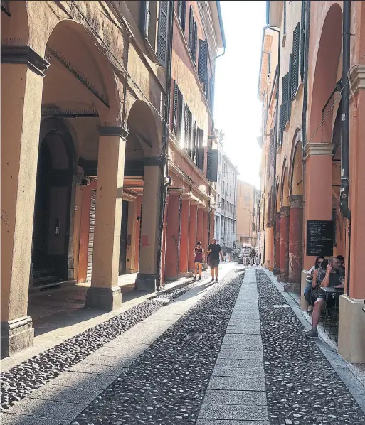  ?? JADA YUAN THE NEW YORK TIMES ?? A street view in Bologna, Italy. To truly understand Bolgna, one needs to visit the bustling Via del Pratello.