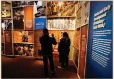  ?? (AP Photo/Mark Humphrey) ?? Guests peruse an exhibit in the National Museum of African American Music.