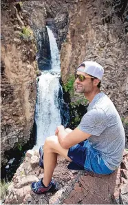  ?? COURTESY OF SANTA FE COUNTY ?? A visitor enjoys Nambé Falls, one of the sites featured on Santa Fe County’s new app designed to help people enjoy the county’s many excursions.