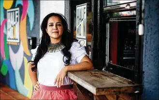  ?? SCOTT MCINTYRE/THE NEW YORK TIMES ?? Pilar Guzman Zavala, who owns Half Moon Empanadas, outside one of her locations in Miami on April 2. A year after the Paycheck Protection Program started, studies show how its design hurt Black- and other minority-owned businesses.