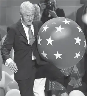  ?? AP/ J. SCOTT APPLEWHITE ?? Former President Bill Clinton has a little fun with a balloon Thursday on the stage at the conclusion of the Democratic National Convention in Philadelph­ia.