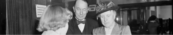  ??  ?? Dame Elizabeth Gilmer, the chair of the Libraries Committee of Wellington City Council, is issued the first free library book in Wellington in 1951.
Beside her is Wellington City Councillor C. A. L. Treadwell. Image credit: Alexander Turnbull Library