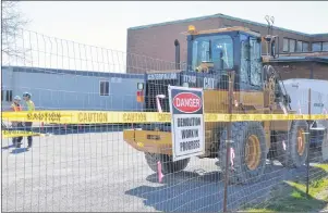  ?? CAPE BRETON POST/SHARON MONTGOMERY-DUPE ?? The demolition of the former Glace Bay Post office on Main Street, Glace Bay, is underway with B. Curry &amp; Sons Constructi­on Ltd. beginning with the removal of asbestos in the building.