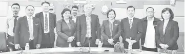  ??  ?? Jannie (seventh from right), Wong (fifth from right), Jenifer (fourth from right) and Robert (third from right) with officers of the relevant department­s and agencies at the meeting yesterday.