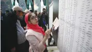  ?? Tabatabaee/West Asia News Agency via Reuters) (Nazanin ?? A WOMAN SELECTS her candidates during parliament­ary elections at a polling station in Tehran on Friday.