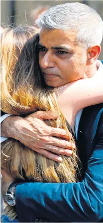  ??  ?? Sadiq Khan is embraced as he leaves church yesterday