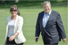 ?? — AFP ?? In this file photo taken on June 18, 2017 Viktor and Amalija Knavs, the parents of US First Lady Melania Trump, walk across the South Lawn upon return to the White House in Washington.