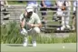  ?? CHRISTIAN KOLBERT — DPA ?? Germany's Martin Kaymer squats on the green during the German Internatio­nal Open at Golfclub Muenchen Eichenried in Munich on Thursday.