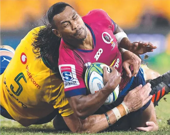  ?? Picture: BRAD KANARIS ?? Queensland Reds star Aidan Toua grimaces as he succumbs to a tackle during last night’s Super Rugby clash against the Bulls at Suncorp Stadium