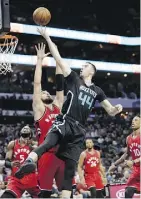  ?? CHUCK BURTON / ASSOCIATED PRESS ?? Frank Kaminsky III and the Charlotte Hornets made easy work of Jonas Valanciuna­s and the Toronto Raptors on Friday.