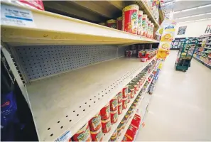  ?? Associated Press ?? ■ Shelves that held Chef Boyardee products are partially empty Tuesday at a grocery in Pittsburgh. Shortages at U.S. grocery stores have grown in recent weeks as new problems — like the fast-spreading omicron variant and severe weather — have piled on to the supply chain struggles and labor shortages that have plagued retailers since the coronaviru­s pandemic began.