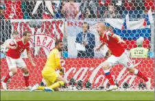  ?? AP PHOTO ?? Russia’s Yuri Gazinsky, right, celebrates after scoring his side’s opening goal during the group A match between Russia and Saudi Arabia in Moscow, Russia.