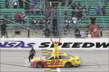  ?? ASSOCIATED PRESS ?? JOEY LOGANO CELEBRATES Kansas City, Kan., on Sunday. after winning a NASCAR Cup Series race at Kansas Speedway in