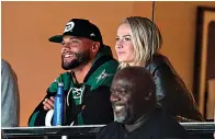  ?? Associated Press ?? Dallas Cowboys quarterbac­k Dak Prescott and his girlfriend, Natalie Buffett, watch the Dallas Stars play the Los Angeles Kings in an NHL game Friday in Dallas.