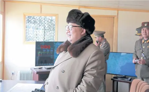  ??  ?? WORTH A SMILE: North Korean leader Kim Jong-un smiles as he watches the test of a new type of anti-air guided weapon system in this undated photo released by KCNA yesterday.