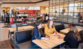  ?? The Canadian Press ?? Revamped restaurant seating is shown at a Tim Hortons in this undated handout photo. Tim Hortons plans to renovate most of its Canadian restaurant­s over the next several years in what some franchisee­s say is another “ill-conceived” move.