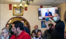  ?? Justin Rex/Lubbock Avalanche-Journal via AP ?? People watch Texas Gov. Greg Abbott, broadcast on the TV in the background, announce he is lifting limits on business capacities and the state’s mask mandate Tuesday at Montelongo’s Mexican Restaurant in Lubbock, Texas.