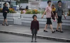  ??  ?? File photo shows a child stands on a roadside in Pyongyang.