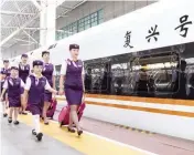  ??  ?? Children of train attendants experience their mothers’ work on G7047/G7048 running between Nanjing and Shanghai, August 27, 2019. (Photo by Su Yang)