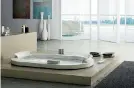  ??  ?? Benessere. La vasca idromassag­gio Jacuzzi Opalia, in Corian, con un design ispirato alle antiche vasche termali