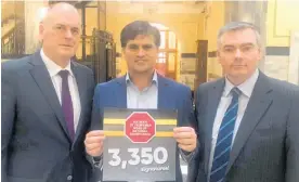  ?? Photo / Supplied ?? MPs Todd Muller (left) and Scott Simpson (right) joined campaigner Andrew Hollis in Parliament yesterday when he presented his 3350-signature petition seeking safety improvemen­ts on State Highway 2.