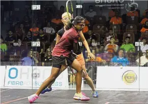  ?? — MUHAMAD SHAHRIL ROSLI / The Star ?? One more step: S. Sivasangar­i (front) returning a shot to Satomi Watanabe in the semi-final of the Malaysian Open at the National Squash Centre in Bukit Jalil yesterday.