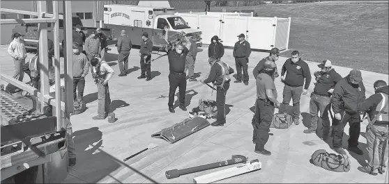  ?? MINDY MCKENZIE/SDG NEWSPAPERS ?? The Ohio Fire Academy traveled to Shelby on Saturday to perform a grain rescue class.