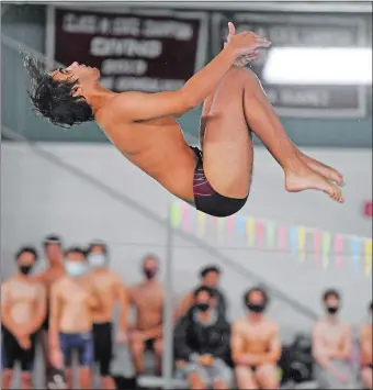  ?? SEAN D. ELLIOT/THE DAY ?? East Lyme’s Ryan McLaughlin executes a dive during a Jan. 4 meet against Waterford. The senior will attempt to win his third straight ECC diving championsh­ip this afternoon at East Lyme.