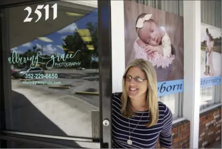  ?? JOHN RAOUX — THE ASSOCIATED PRESS ?? In this photo taken Cathy Cooper leaves her photo studio in Ocala, Fla. Cooper, a cancer survivor, is concerned that if the GOP health bill goes through, she may not have access to the kind of health insurance she needs to make sure she stays cancer...