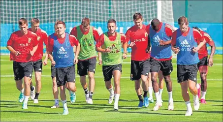  ?? REUTERS ?? Belgium's Eden Hazard with teammates during training on Wednesday. Hazard and teammate Kevin De Bruyne will miss the opening game against Russia.